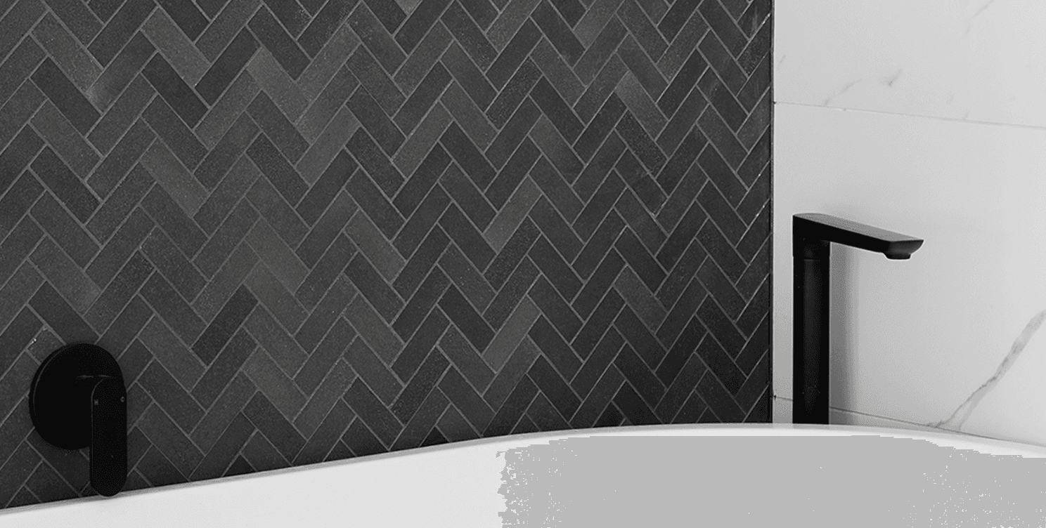 Grey Herringbone formation bathroom tiles